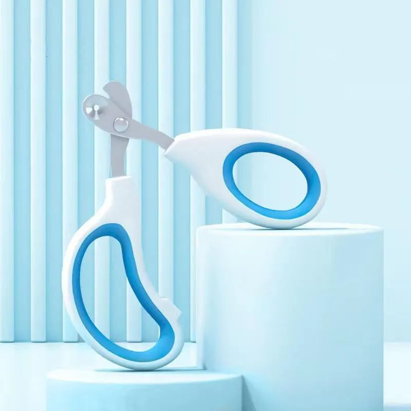 Blue pet nail clippers with circular safety-guide hole and cushioned non-slip handles.