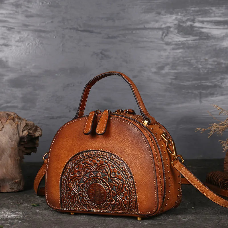 Vintage suede cowhide leather handbag showing interior mobile phone compartment, ID pocket, and laminated zipper pocket