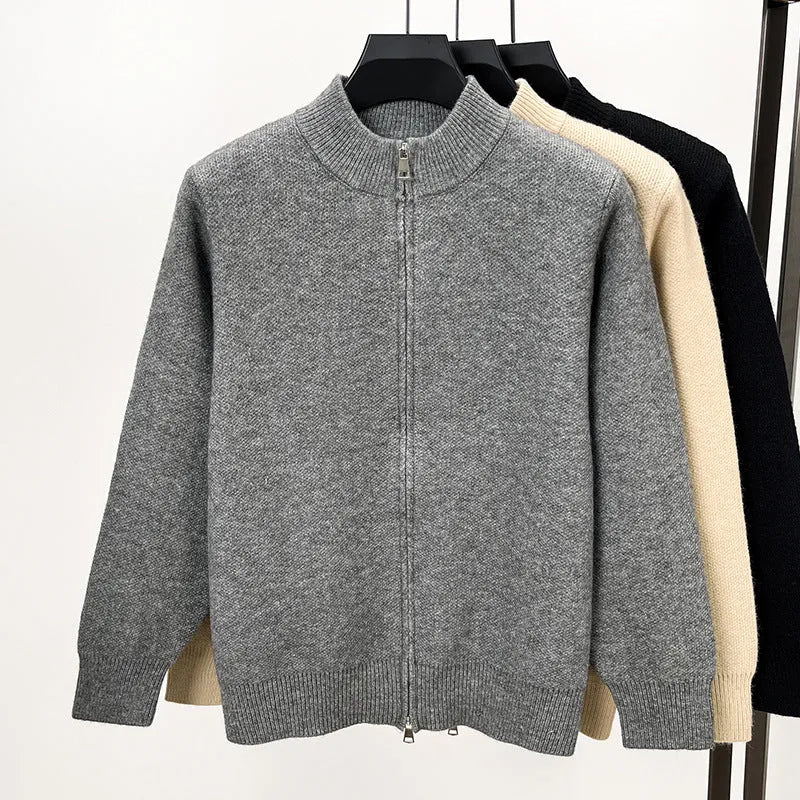 Men's black knitted zip-up cardigan with a stand collar and loose fit.