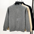 Men's black knitted zip-up cardigan with a stand collar and loose fit.