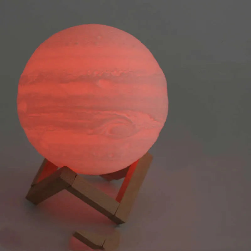 3D printed moon lamp on wooden stand with touch control ring at base, showing white and yellow light colours.