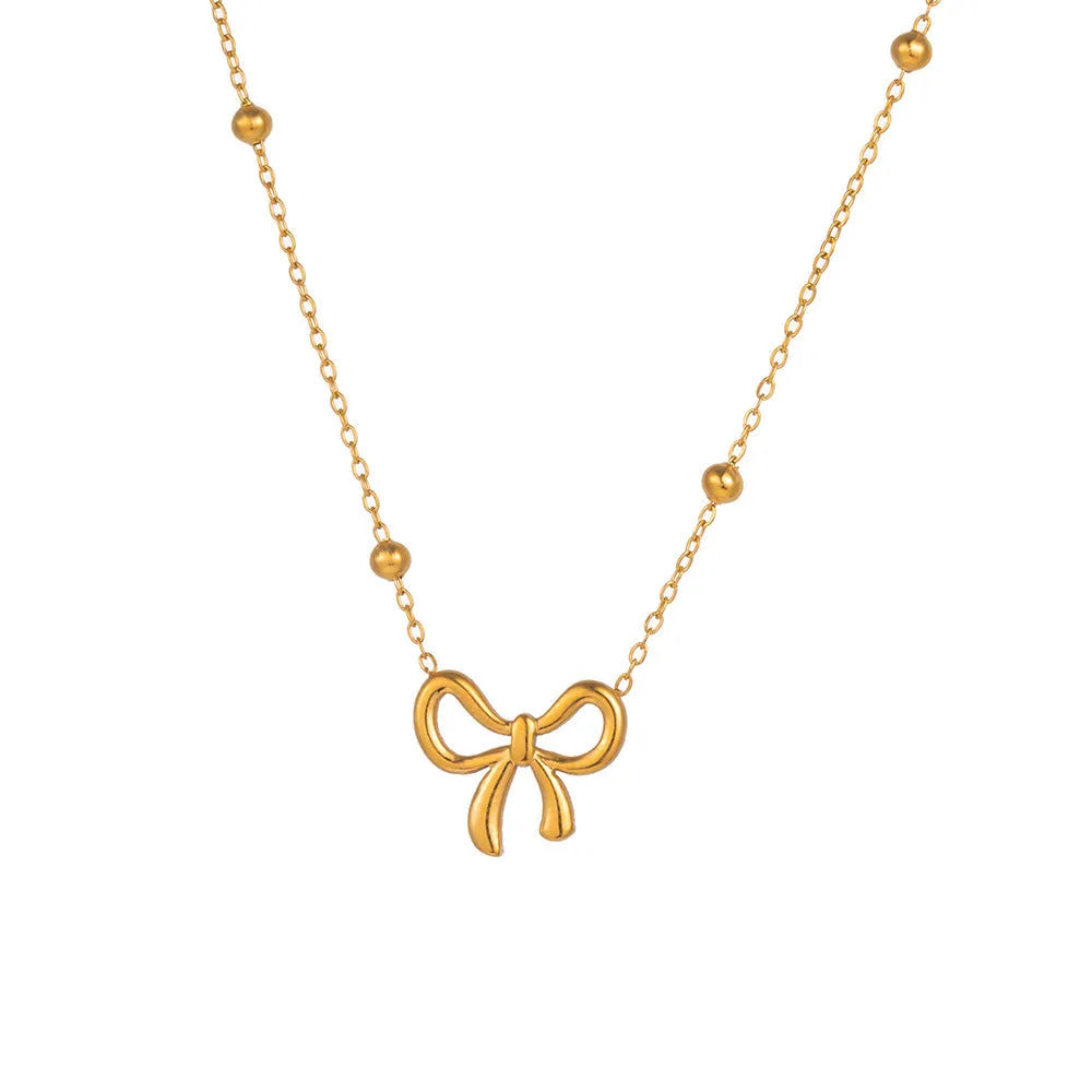 Gold electroplated bow pendant necklace with titanium steel cross chain, adjustable length