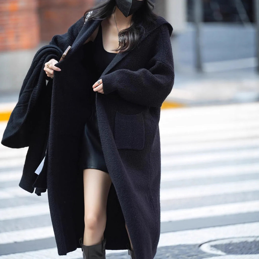 Long grey knitted cardigan hooded trench coat with loose fit and long sleeves.
