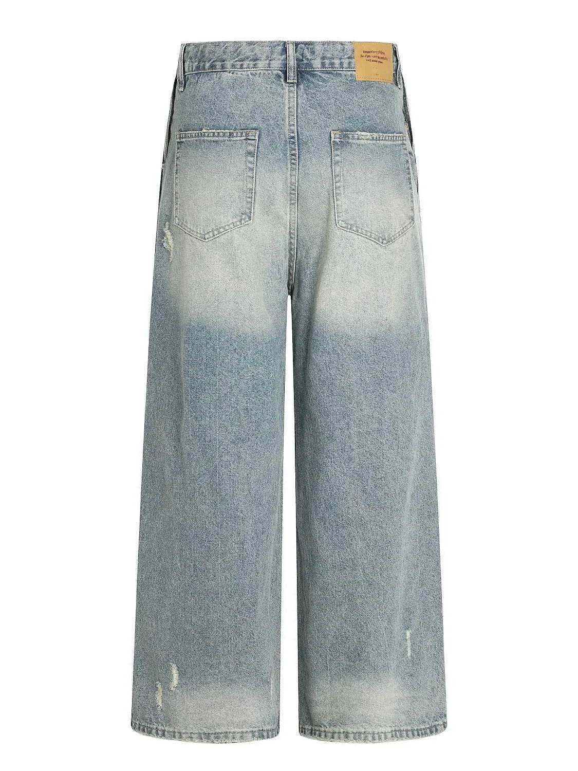 Water washed hole jeans in retro blue with loose straight leg and zip fly for women