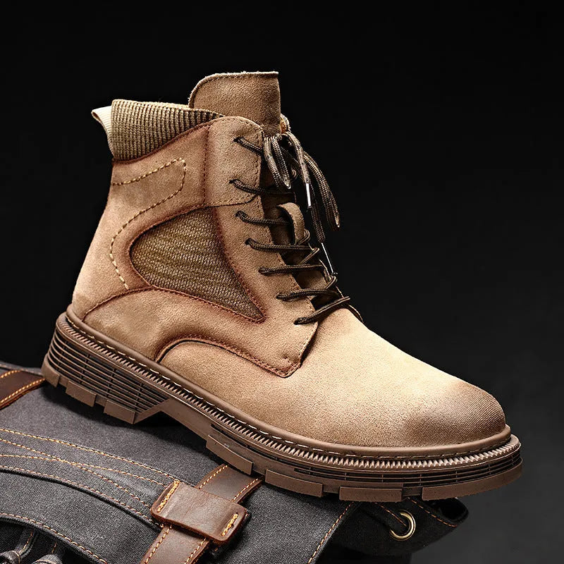 Men's vintage brown Martin ankle boots with round toe and thick low heel on a plain background.
