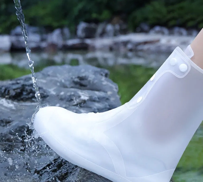 White PVC high top reusable women's water resistant shoe covers showing anti-skid sole and high cylinder design