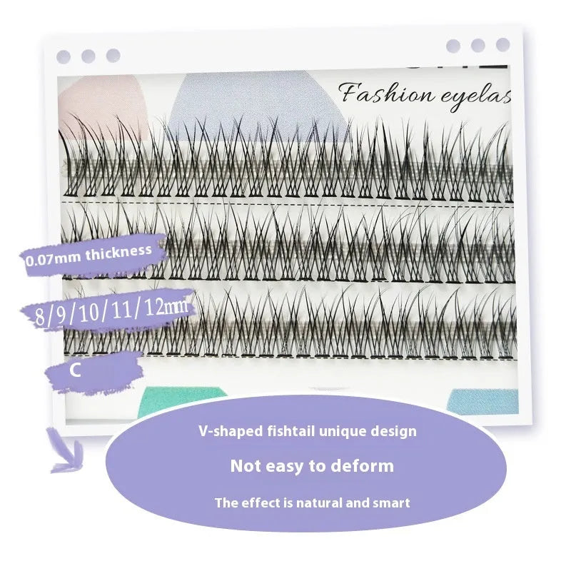 Black V-shaped fairy fishtail false eyelashes with thick segments on a clear tray.