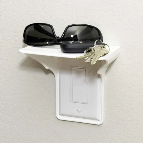 White polypropylene plastic socket organiser rack for storing electrical sockets and power strips.