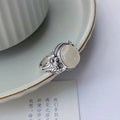 Adjustable copper vintage ring with white chalcedony stone and U-shaped antique design