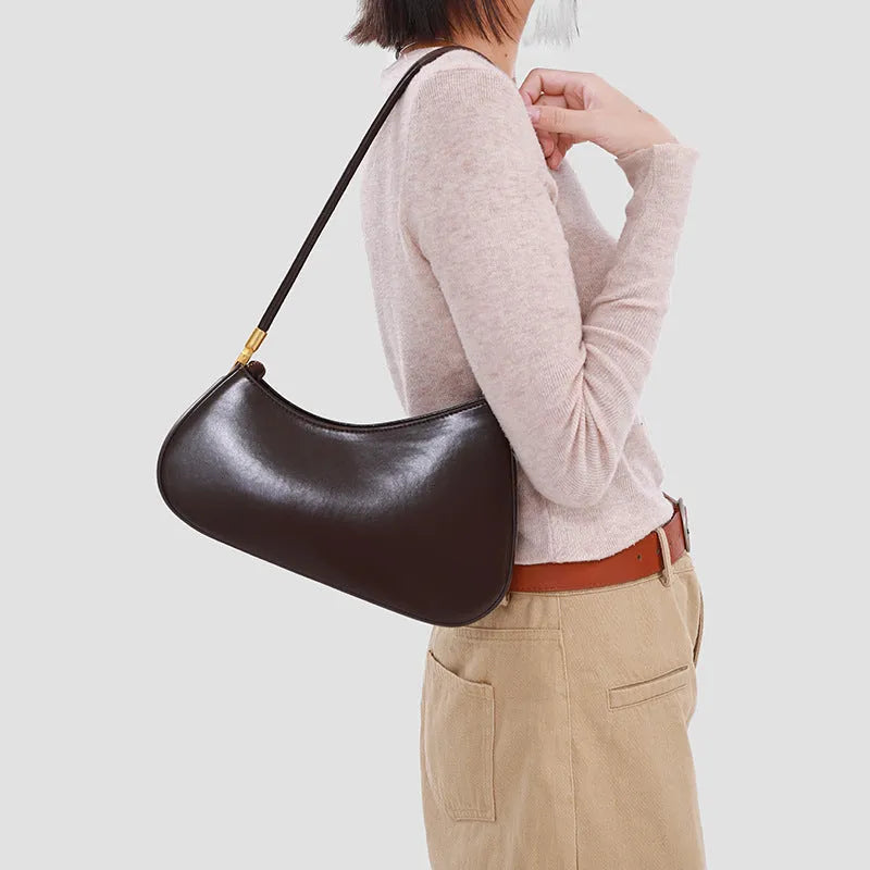 Women's oval shaped PU commuter handbag in multiple colours with internal zip compartment