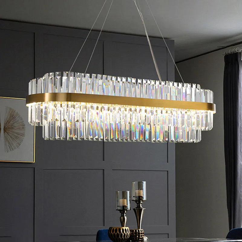 Stainless steel and crystal multi-head chandelier light with adjustable height for ceiling.