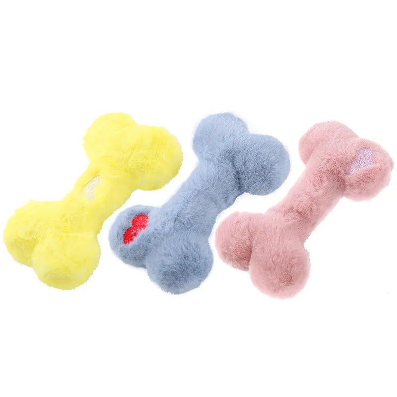 Vocal bone plush dog toy for aggressive chewers in blue, pink and yellow colours with internal squeaker