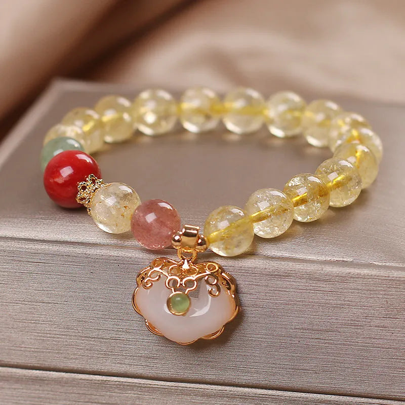 Women's bracelet with a natural yellow citrine jade ruyi pendant on an alloy chain