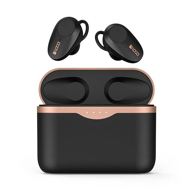 Black wireless Bluetooth headphones with charging stand on a table