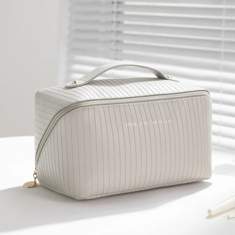 Vertical pattern pillow makeup bag in cubic shape, PU material, shown in available colours.