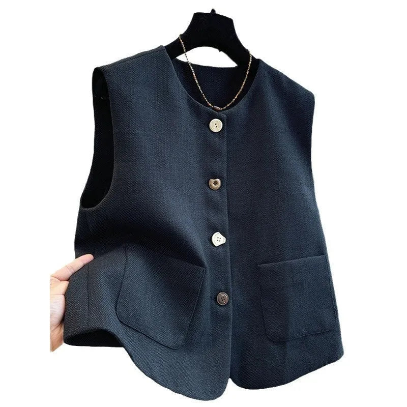 Women's milky white round neck bandage vest made from polyester, laid flat.
