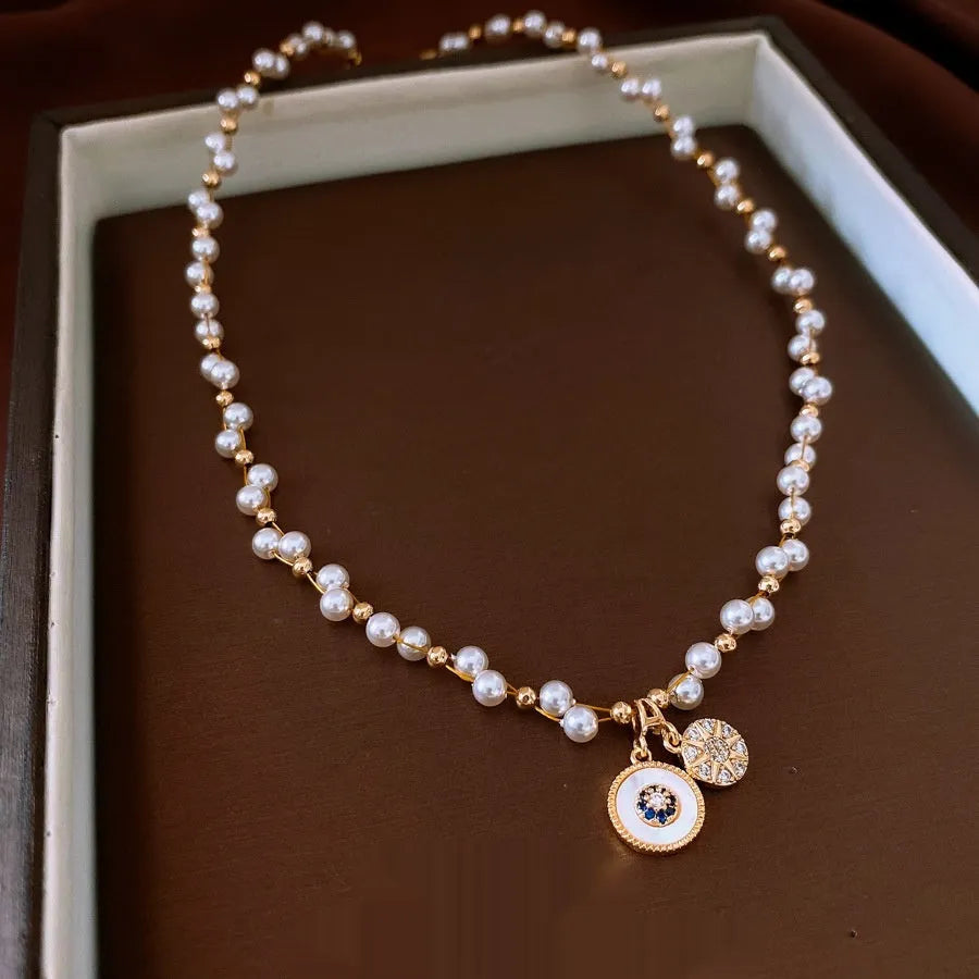 Women's gold electroplated necklace with round zircon-inlaid imitation pearl pendant on clavicle chain