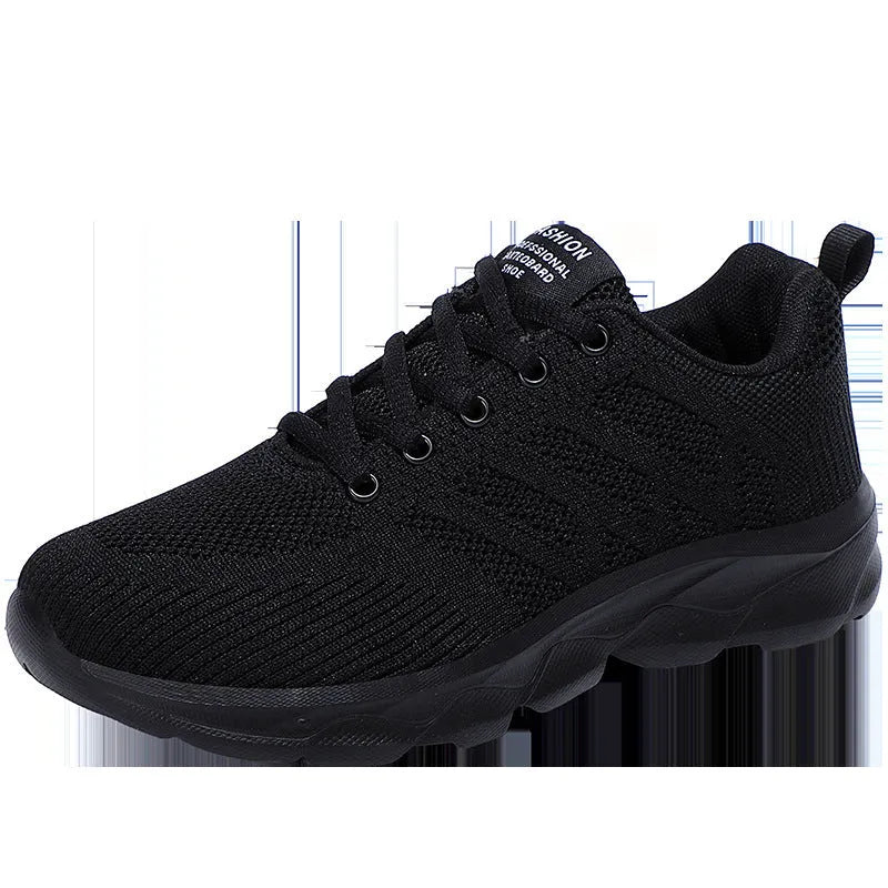 Women's white breathable mesh lace-up shoes with a low heel on a plain background.