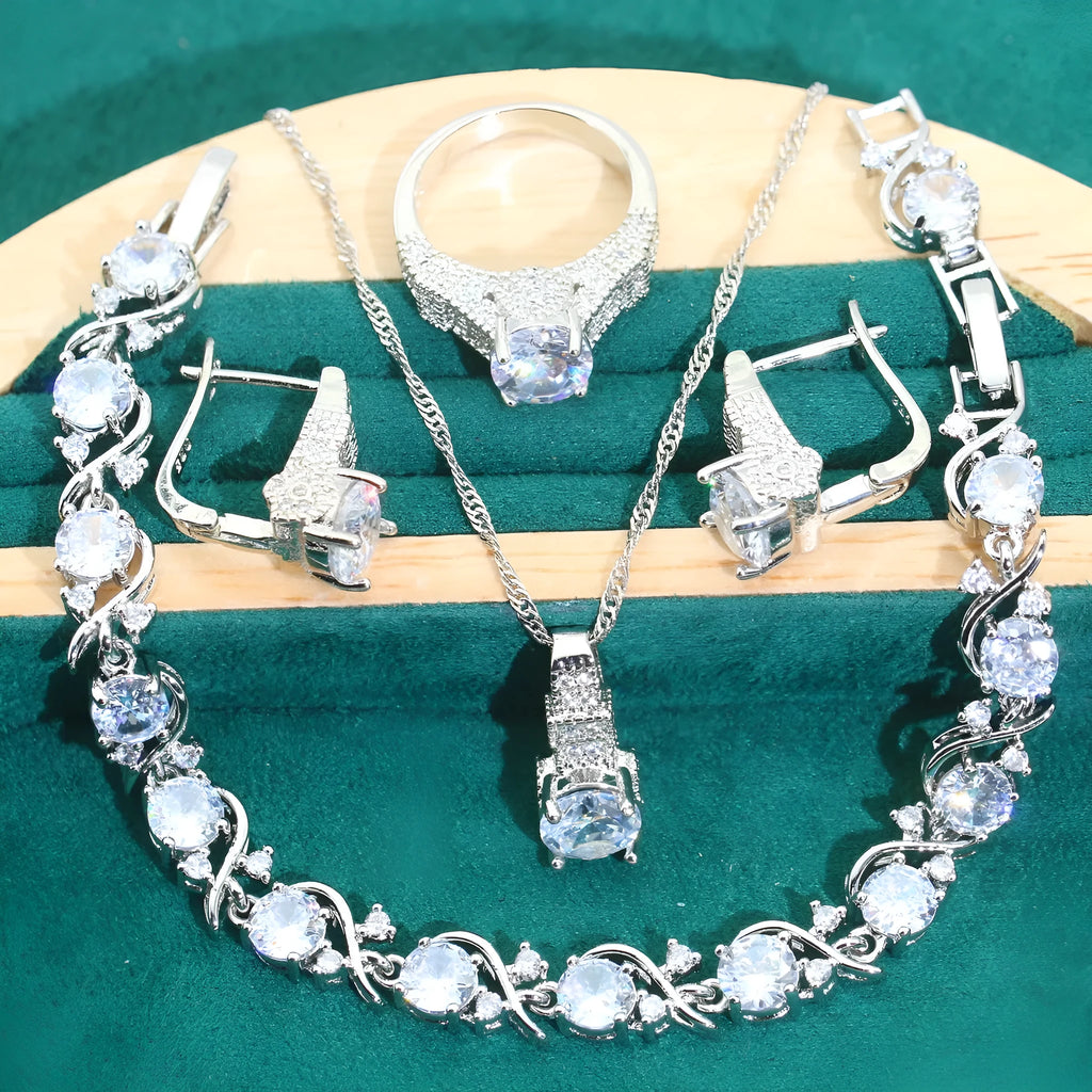 Four-piece bridal jewellery set showing necklace, bracelet, earrings, and ring with water wave chain