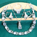 Four-piece bridal jewellery set showing necklace, bracelet, earrings, and ring with water wave chain