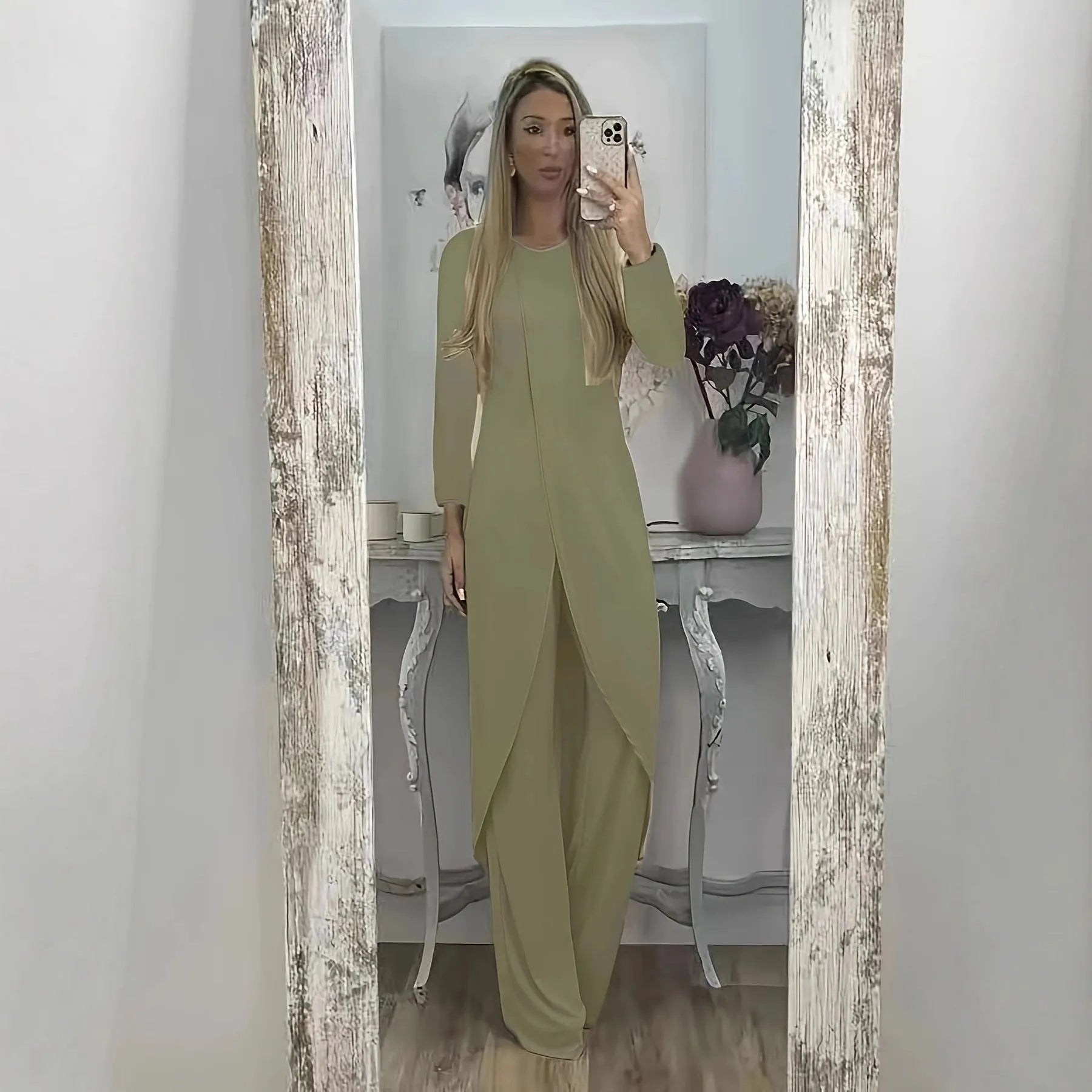 Black casual polyester two-piece tracksuit with long sleeves and trousers on a hanger