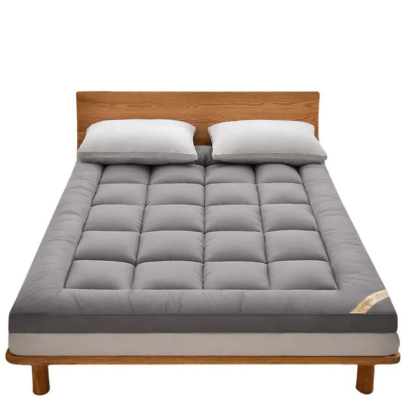 Thickened three-dimensional feather velvet mattress sheet in alpaca colour on a bed