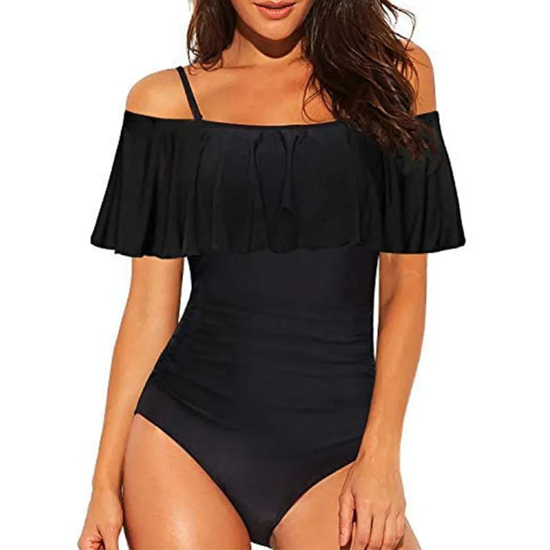 Black one-piece swimsuit with ruffled straps and side cut-out panels on a mannequin.