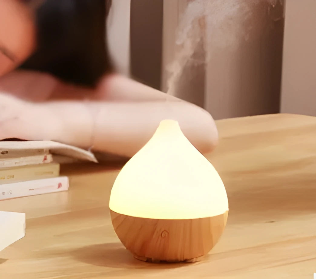 Asakusa wood grain finish vase-shaped USB aroma diffuser on a table.