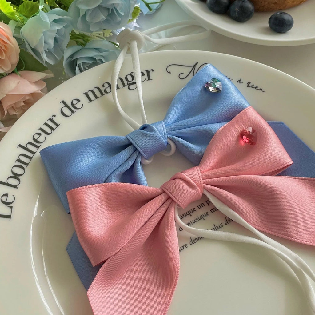 Princess style bow dog hair band with adjustable tension on blue polyester cotton ribbon