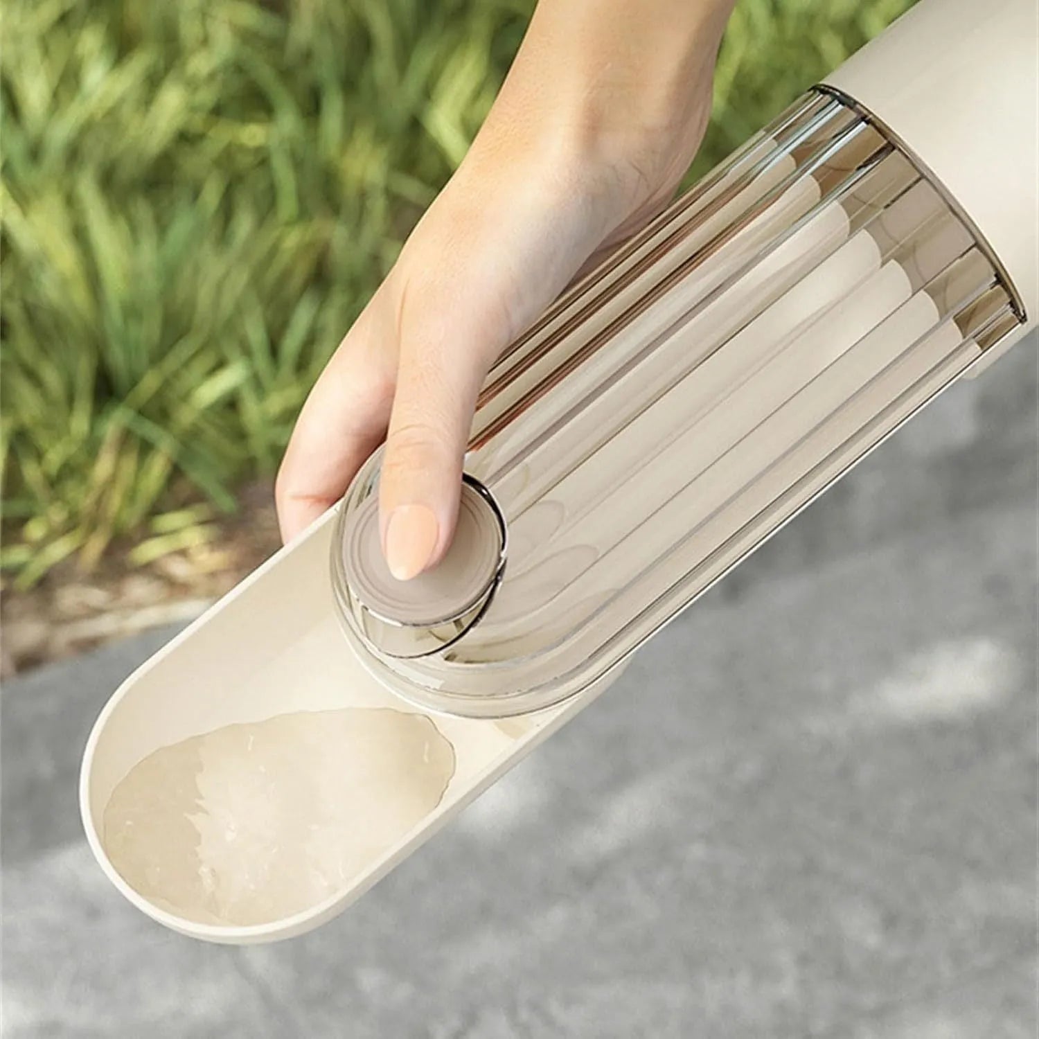 Green foldable dog water bottle with leak-proof lid and food container, shown extended for use.