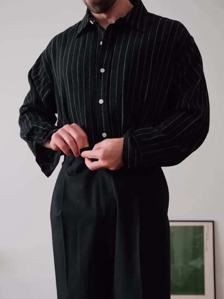 Black pinstriped polyester button-down shirt with collar, shown front view