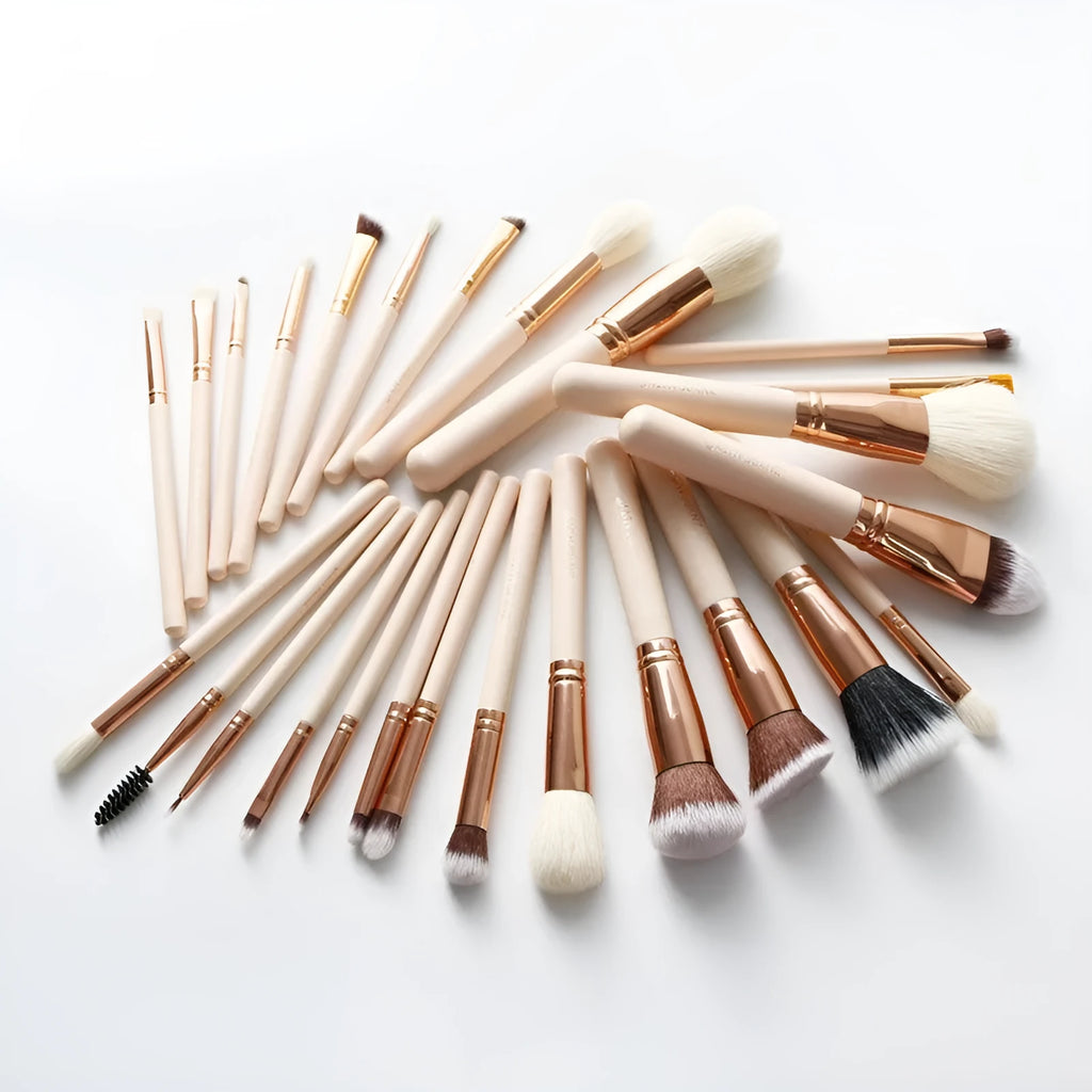 26 pink makeup brushes with wooden handles arranged in a PU carry case.