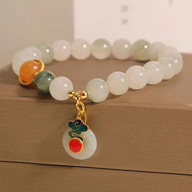 Women's ice jade crystal bracelet with pearl elements and xiangyun peace jade buckle
