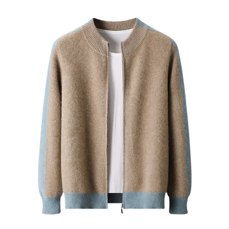 Man wearing a dark blue zip-up cardigan with a half turtleneck collar and thick wool fabric.