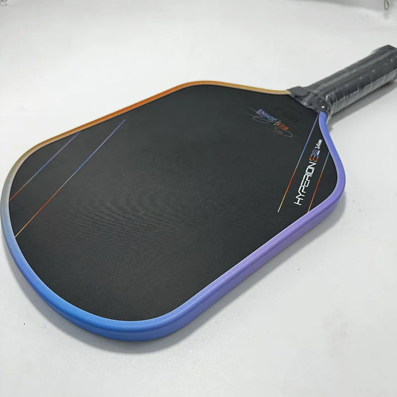 Multicolour matte finish pickleball racket with T700 carbon fibre frame and honeycomb core.
