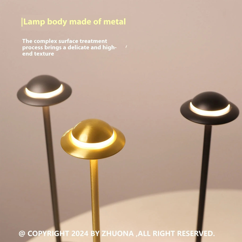 Metallic UFO-shaped desk lamp with touch dimming in black, gold, or grey colour options
