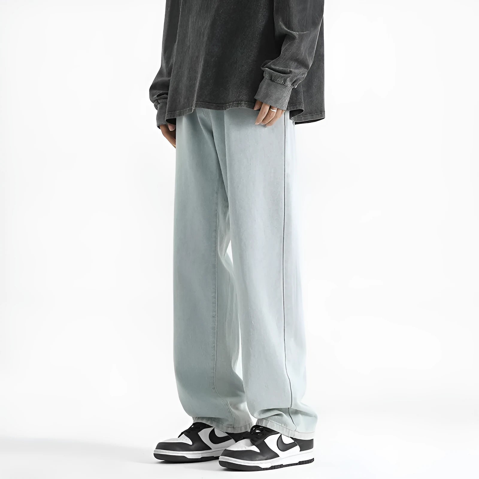 Men's light blue washed straight leg jeans with button waist, made from cotton.
