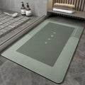 Bathroom floor mat in blue colour, oval shape, showing machine-woven blended texture