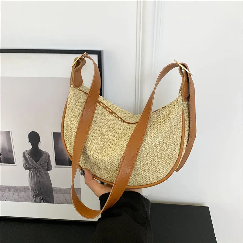 Women's knitted straw woven crossbody bag in corrugated black carrying phone and files