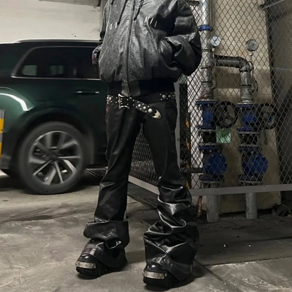 Black coated shiny patent leather skinny jeans in a straight-leg style on a mid waist.