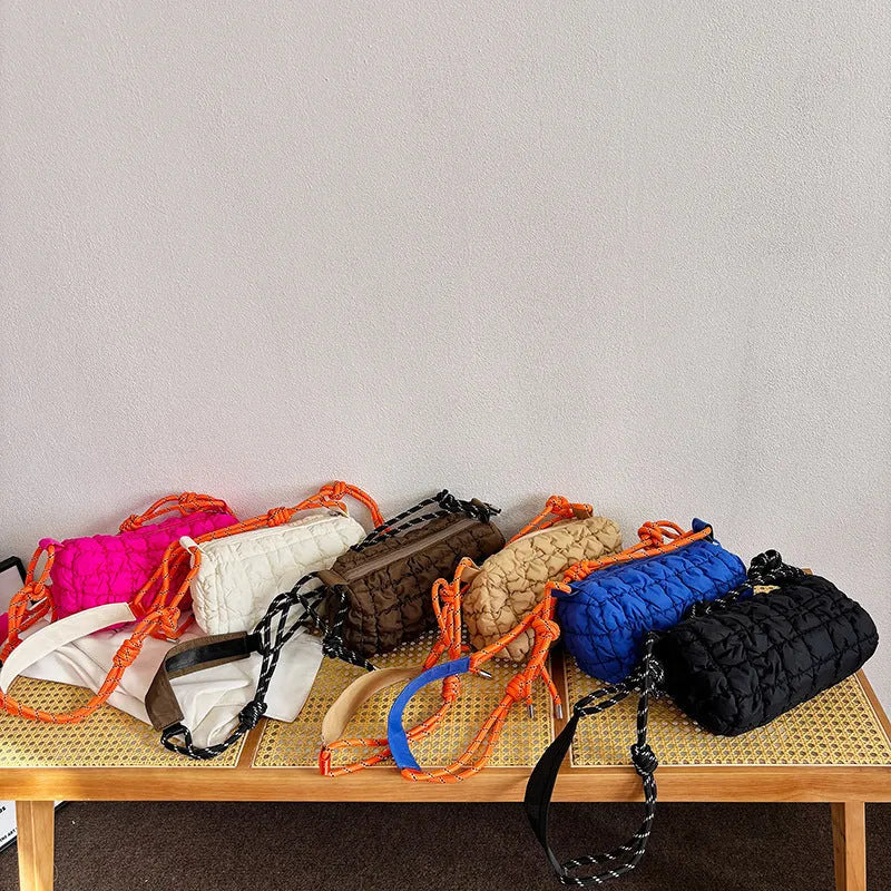Women's soft nylon pillow-shaped messenger bag with diamond quilting and a crossbody strap.