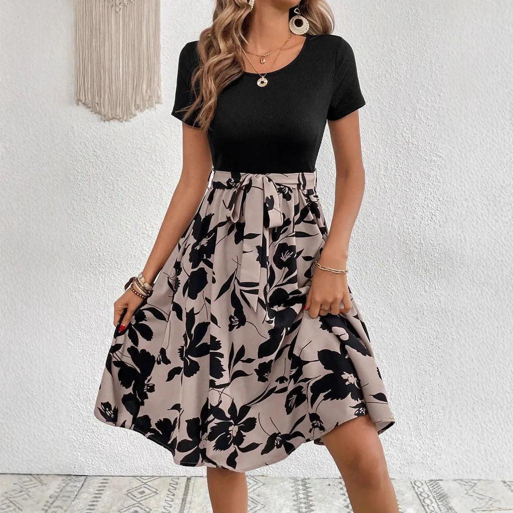 Women's khaki A-line dress with floral pattern, shoulder straps, and lace-up front detail