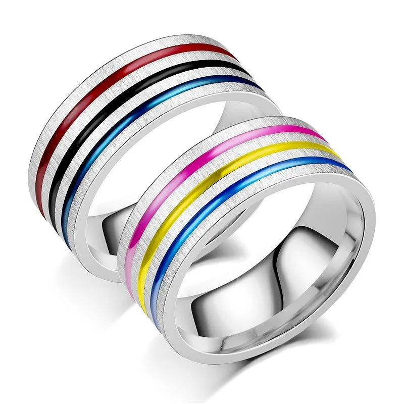 Silver titanium steel ring with rainbow drops of oil pattern and flower shape on white background