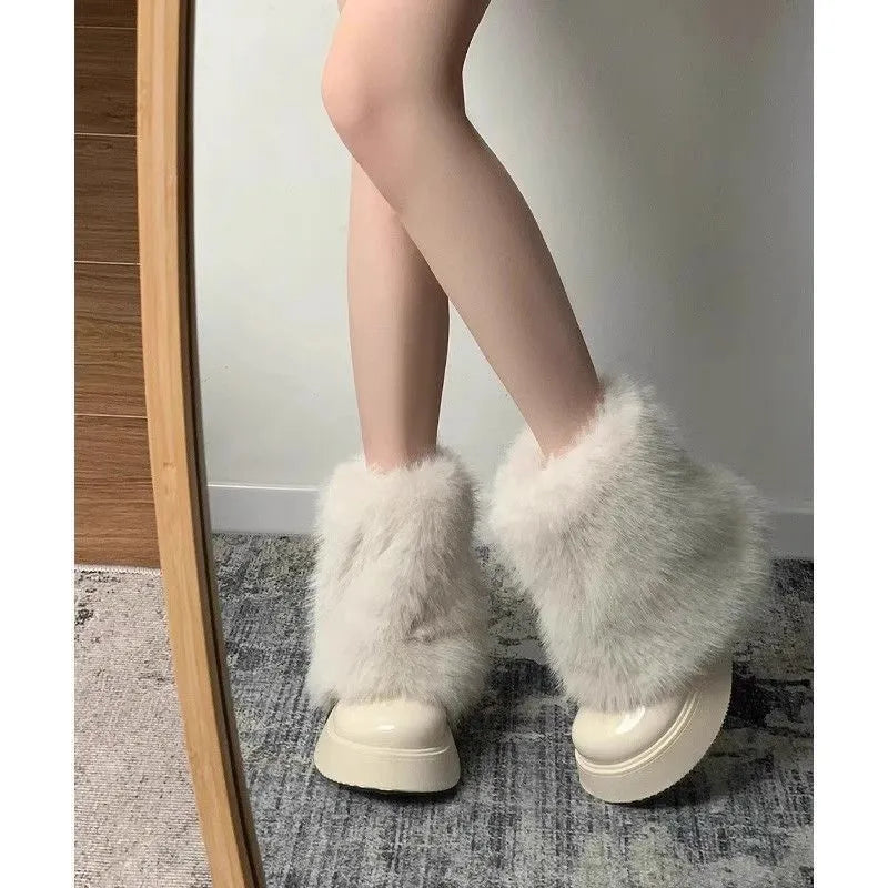 Women's black fleece-lined snow boots with a waterproof platform and round toe on a rubber sole.