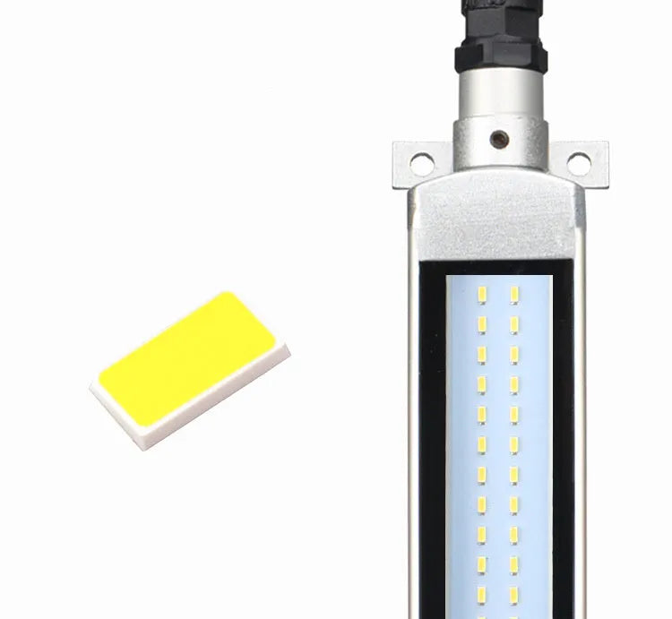 Long, rectangular LED work light with aluminium body and tempered glass front, mounted with a bracket for CNC machine tools.