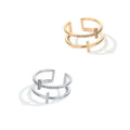 Adjustable double cross geometric ring in white gold colour with sterling silver and zircon gem inlay.