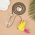Grey and yellow hanging interactive cat toy mounted on door frame with elastic rope and treat bulb