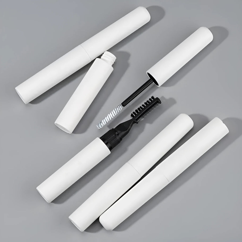 Eyebrow mould shaping brush and bottle of liquid eyebrow glue in pink or white.