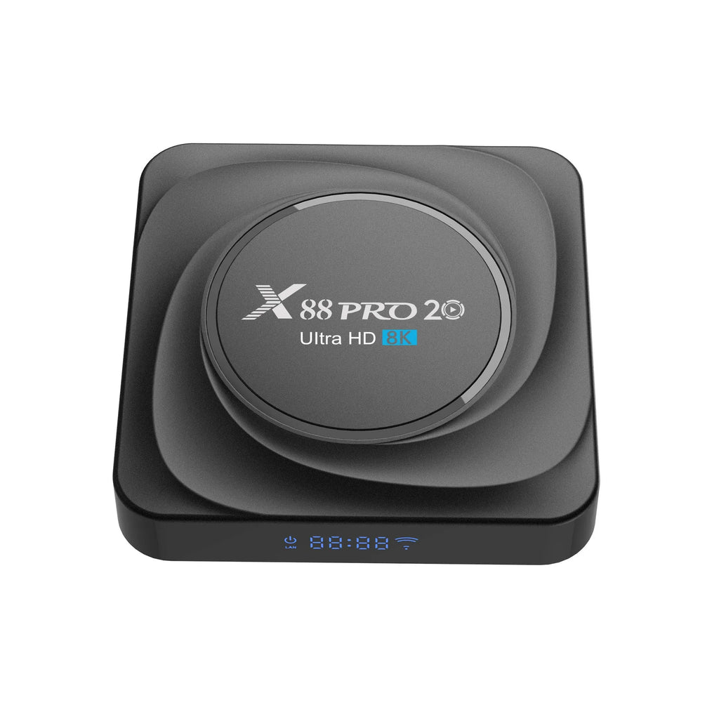 Compact black Android 11 TV box with remote control and HDMI cable on a table