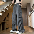 Plus size straight-leg waterproof trousers in black, grey, or white.